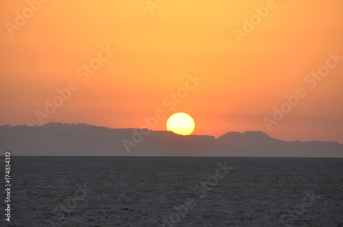 Fototapeta Naklejka Na Ścianę i Meble -  Sunrise on salt lake in the Sahara desert, Tunisia
