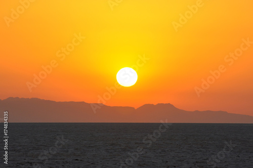 Sunrise on salt lake in the Sahara desert, Tunisia