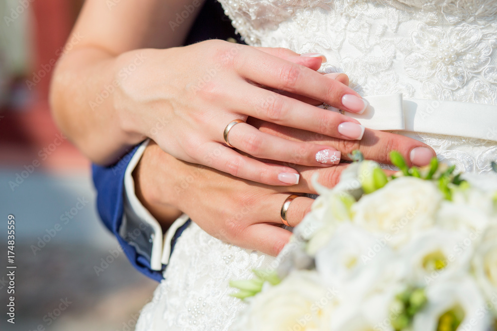 The couple cuddling and holding bridal bouquet. The couple cuddling and holding bridal bouquet.
