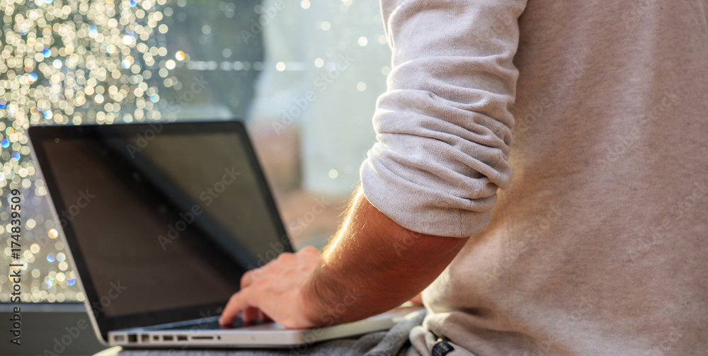 Man working with a laptop at home