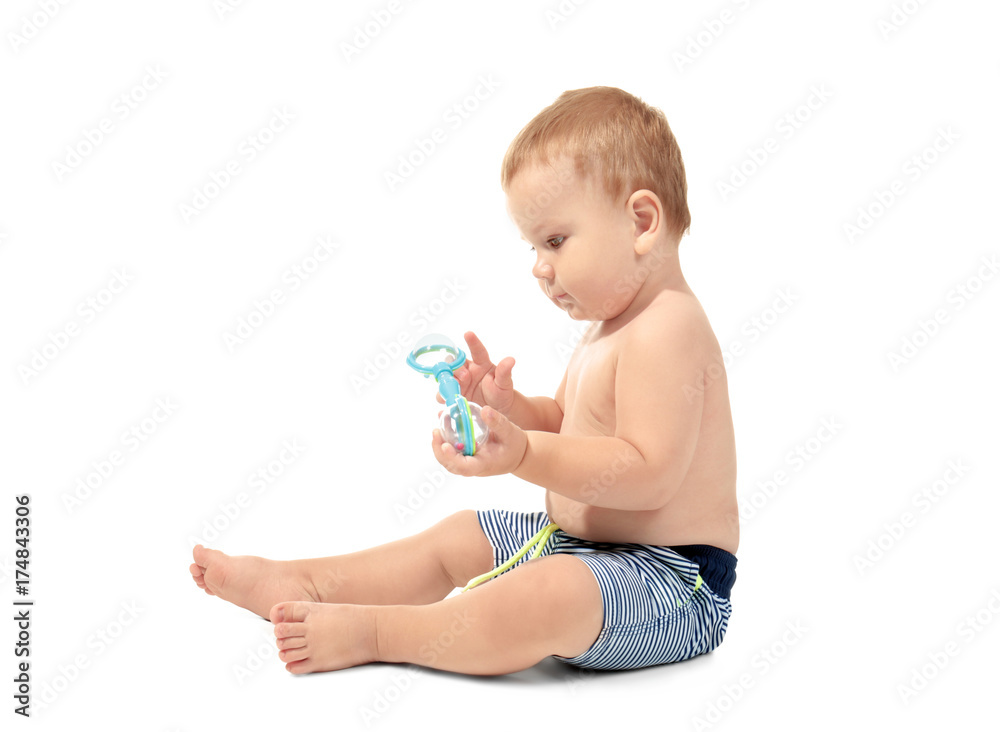 Cute little baby in swim shorts, isolated on white Cute little baby in swim shorts, isolated on white