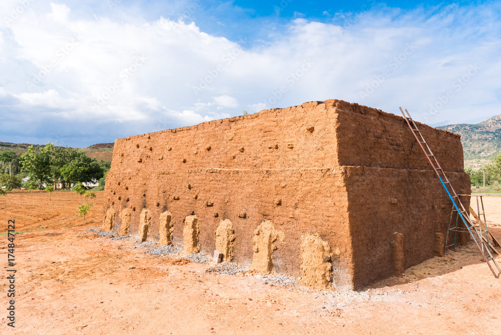 Production of indian bricks. The brick dries, Puttaparthi, Andhra Pradesh, India. Copy space for text.