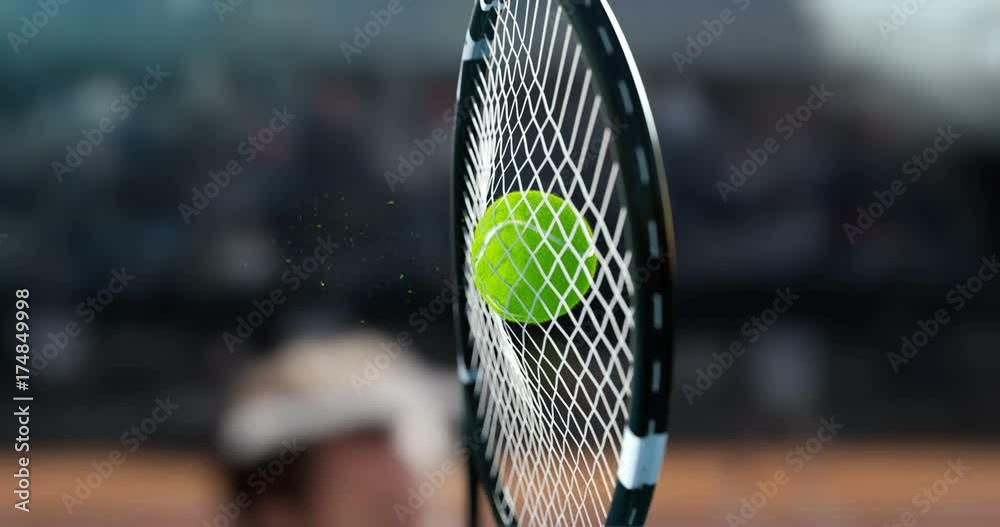 Tennis racket hit the tennis ball, in a super slow-motion, you see a deformation of the ball and small particles.