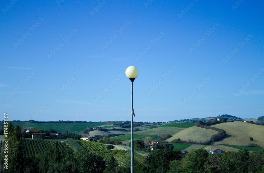 Landscape behind the street lamp (Montecchio, Italy) Landscape behind the street lamp (Montecchio, Italy)