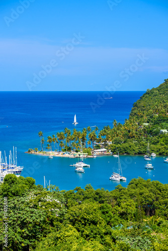 Marigot Bay, Saint Lucia, Caribbean. Tropical bay and beach in exotic and paradise landscape scenery. Marigot Bay is located on the west coast of the Caribbean island of St Lucia.