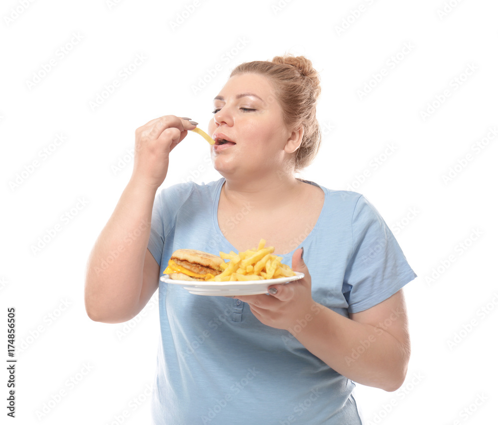 Overweight young woman with plate of fast food on white background Overweight young woman with plate of fast food on white background