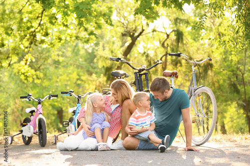 Happy family in park on sun...