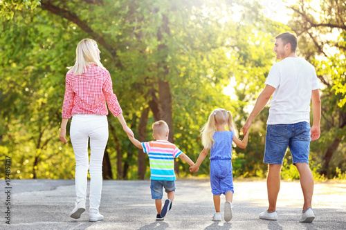 Happy family in park on sun...