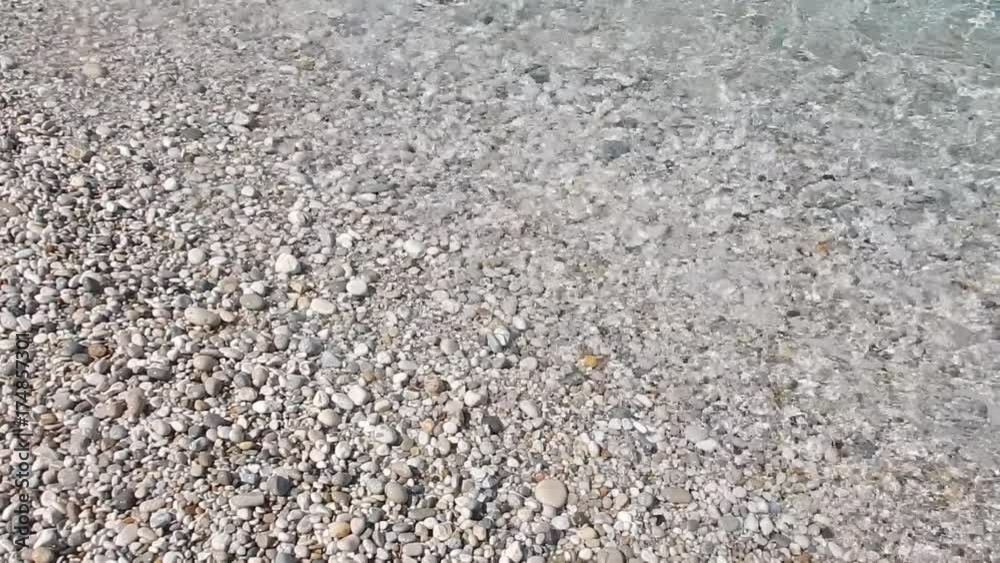 Transparent limpid turquoise sea on a stone seashore. Transparent limpid turquoise sea on a stone seashore.