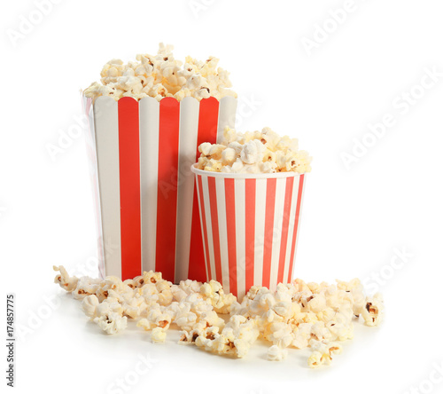 Paper box and cup with popcorn on white background