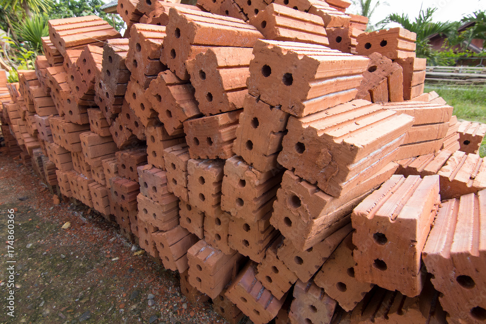 Group of clay brick used in construction work and use as for background.Selective focus