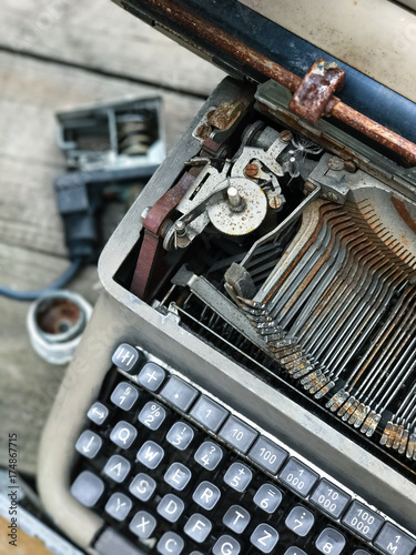 Old retro unnecessary faulty typewriter, professional writer equipment