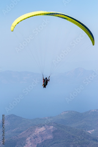 Skydiver landing with a awesome mountains background