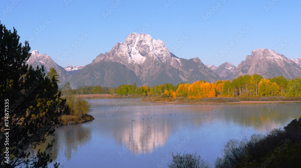 Nature is Grand-Morning at Oxbow Bend-Autumn colors and snow-capped Mount Moran,  are both reflected in Snake River, in Grand Teton National Park
