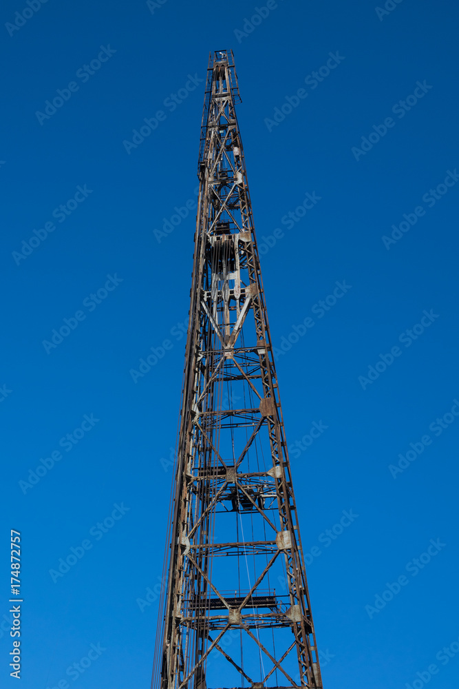 Vintage crane hook with blue sky backgrounds