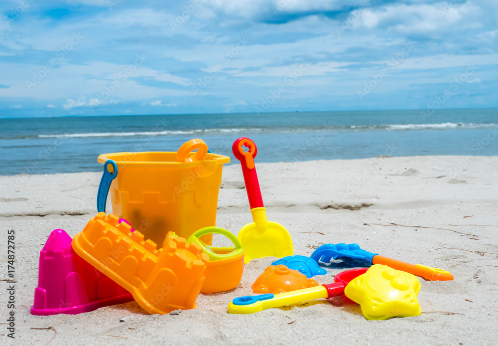 Summer time and kids toys on tropical sand beach Summer time and kids toys on tropical sand beach