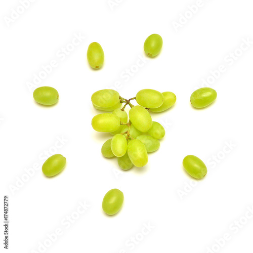 Fresh green grapes branch isolated on white background. Creative concept of fruit, butterfly shape. Flat lay, top view