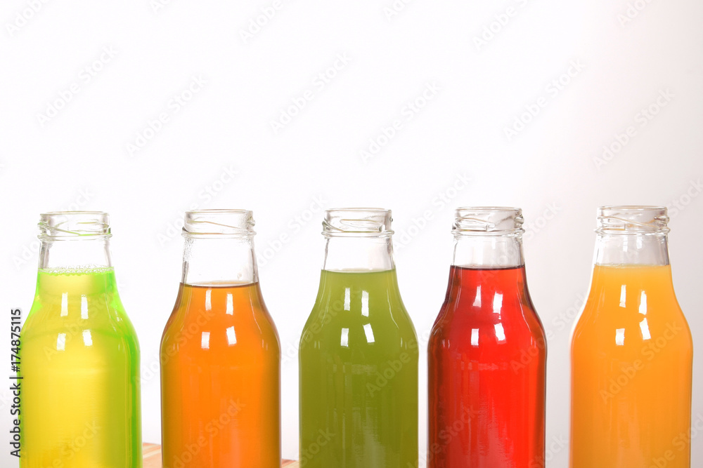 fruit juice in glass bottles with empty space for text fruit juice in glass bottles with empty space for text