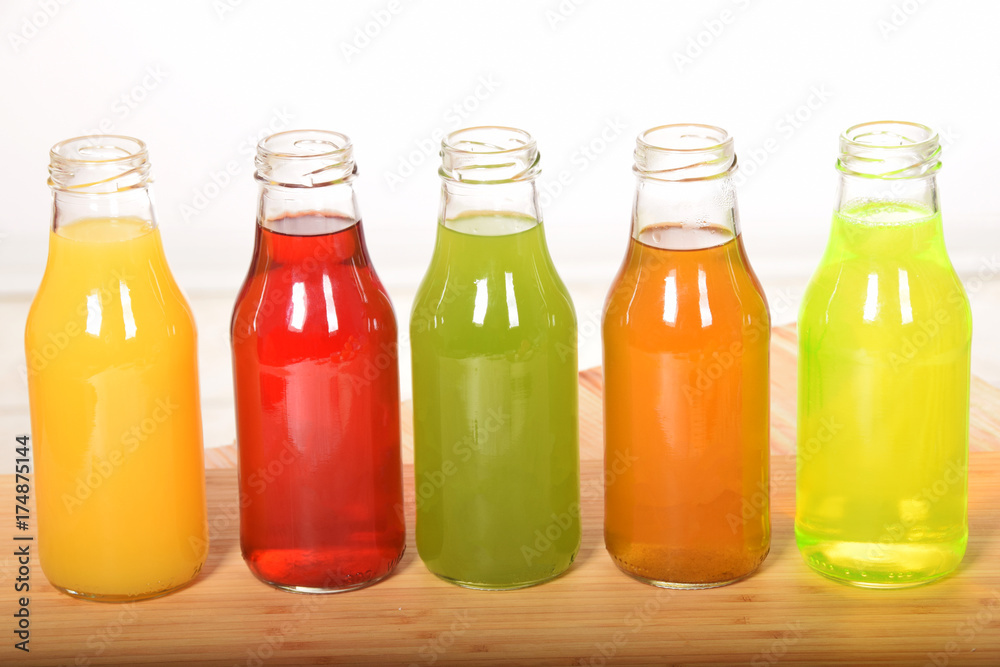fruit juice in glass bottles with empty space for text fruit juice in glass bottles with empty space for text