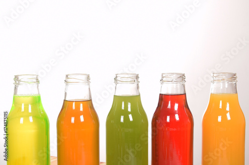 fruit juice in glass bottles with empty space for text