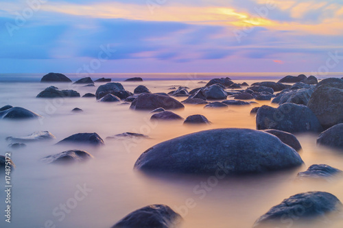 Beautiful seascape background, rocks in the Irish Sea at Seascale beach, Cumbria, England, United Kingdom