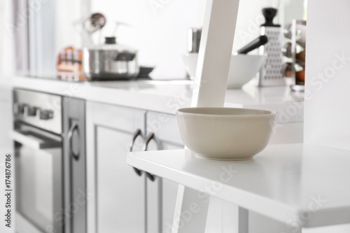 Bowl on shelf in modern kitchen