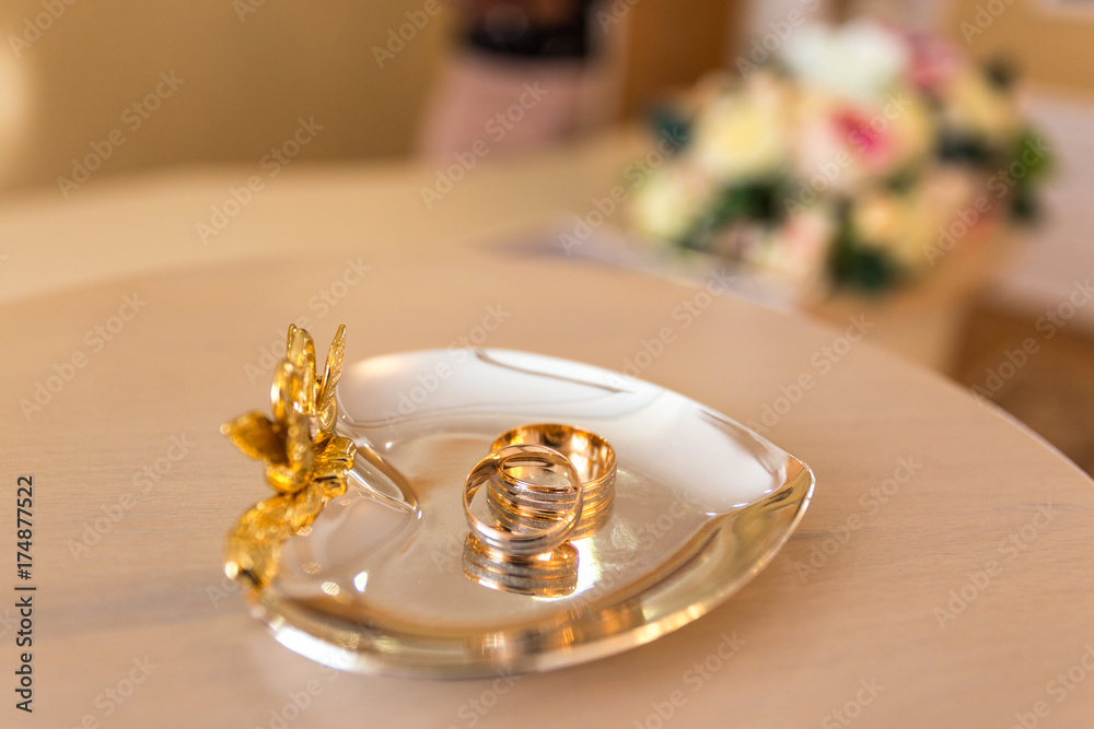 Gold wedding rings on the stand for rings Gold wedding rings on the stand for rings