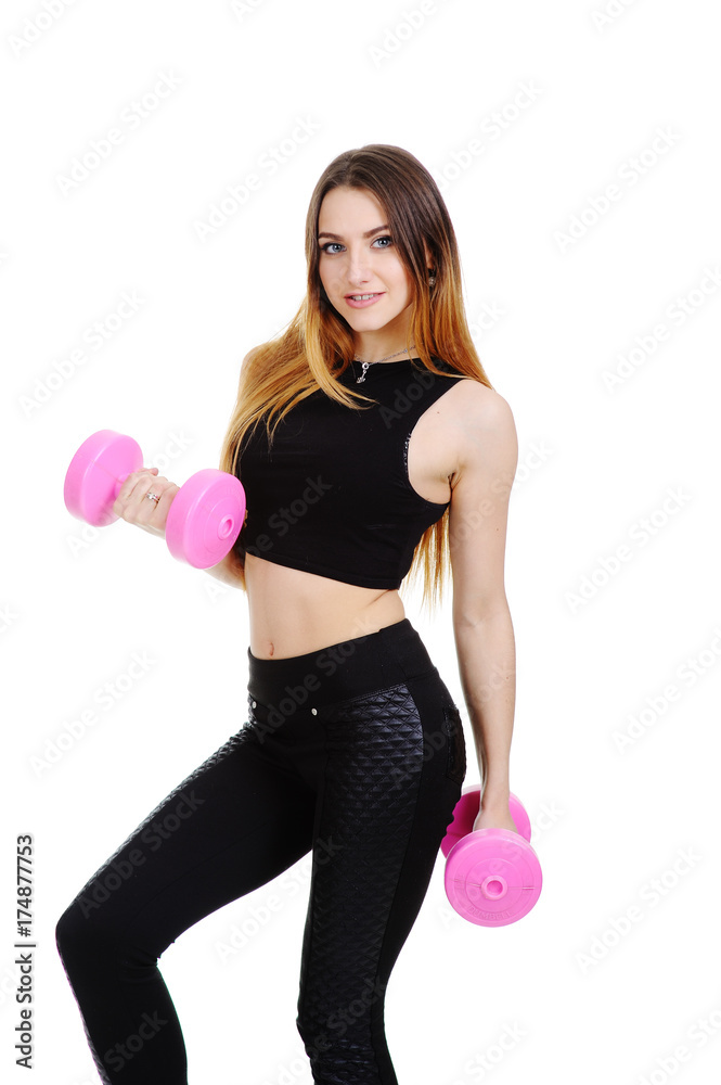pretty girl in a black tracksuit with pink dumbbells on a white background pretty girl in a black tracksuit with pink dumbbells on a white background