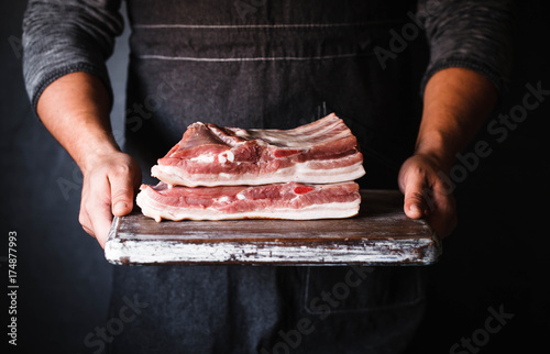 Pork belly Farm fresh Pork Belly butcher person curring bacon porchetta