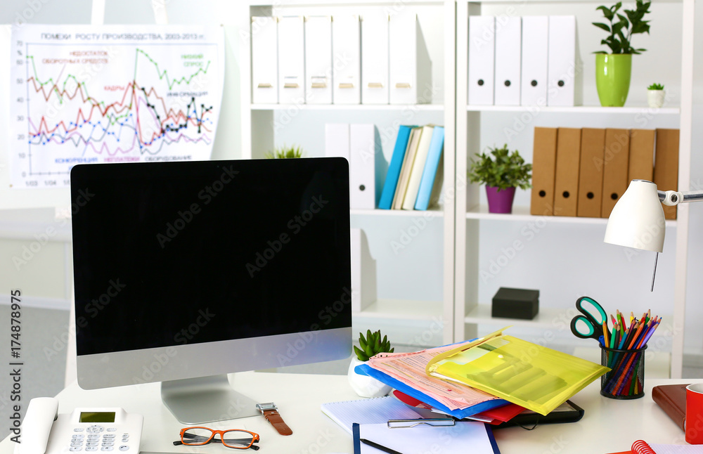 Fototapeta premium Office table with blank notepad and laptop