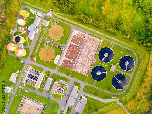 Aerial view to sewage treatment plant in green fields. Grey water recycling. Waste management for 165, 000 inhabitants of Pilsen city in Czech Republic, Europe. 