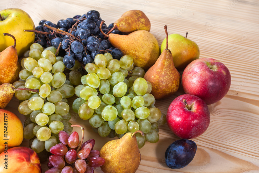 autumnal fruit still life on rustic wooden table background autumnal fruit still life on rustic wooden table background