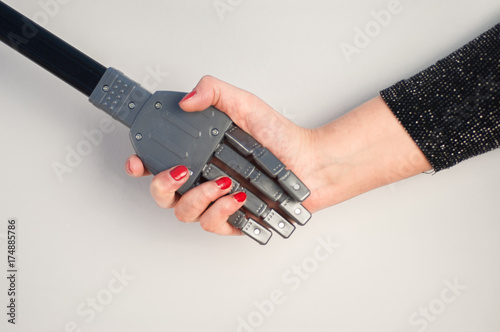 girl and robot handshake