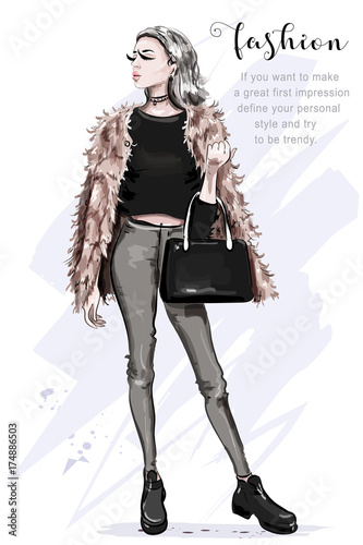 Beautiful young woman in fashion clothes: faux fur jacket, jeans, crop top. Stylish woman with bag. Fashion lady. Sketch.
