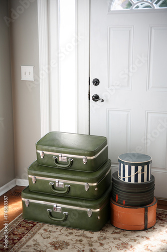 Принти на полотні Set of vintage luggage and hatboxes waiting by the front door.