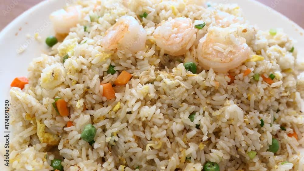 Delicious taiwanese style shrimp fry rice, serve with green beans, eggs and carrots Delicious taiwanese style shrimp fry rice, serve with green beans, eggs and carrots