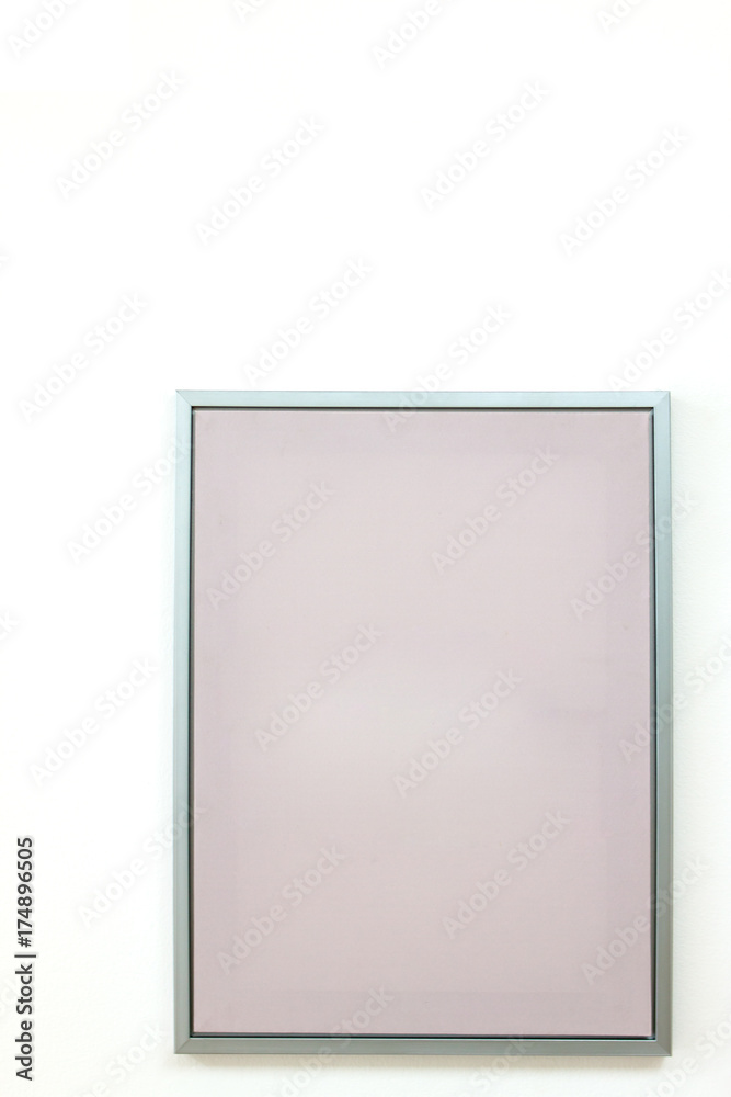 blank frame on a white wall background.