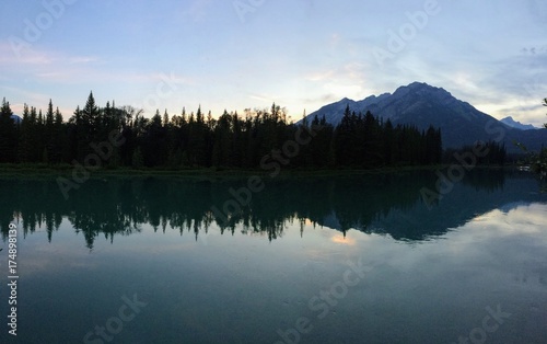 Banff, Bow River, evening reflection with mountain in background