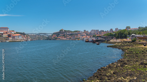 Porto, Portugal, panorama of Dom Luis bridge in background, the river Douro and tiles roofs 