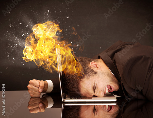 Stressed business man's head is burning