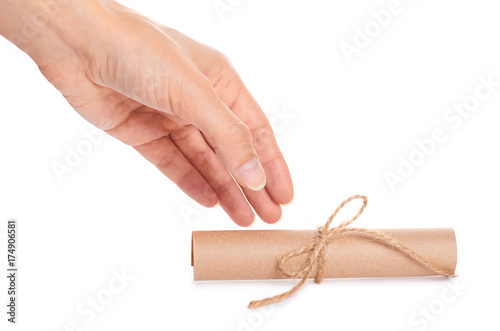 kraft paper scroll in hand isolated on white background photo