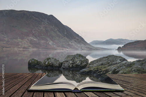 Stunning Winter foggy sunrise on Crummock Water in Lake District England concept coming out of pages in open book