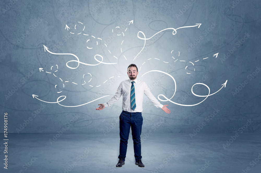 Businessman standing with winding arrows around Businessman standing with winding arrows around
