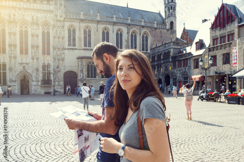 Young couple of tourists walking the streets of a European city.