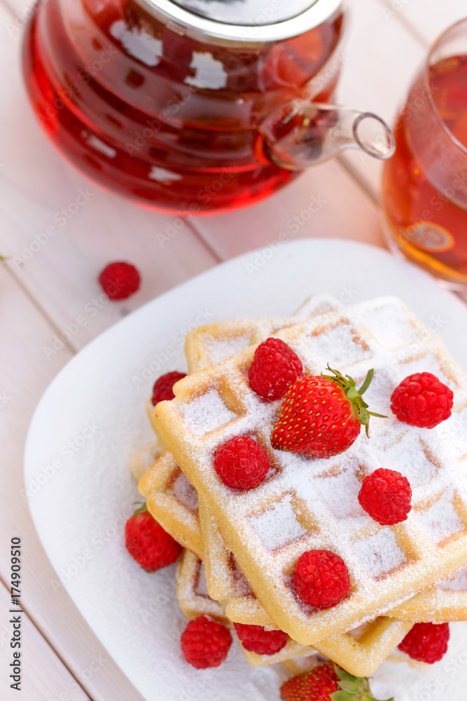 Belgian waffles with strawberries and raspberries. Top view. Belgian waffles with strawberries and raspberries. Top view.