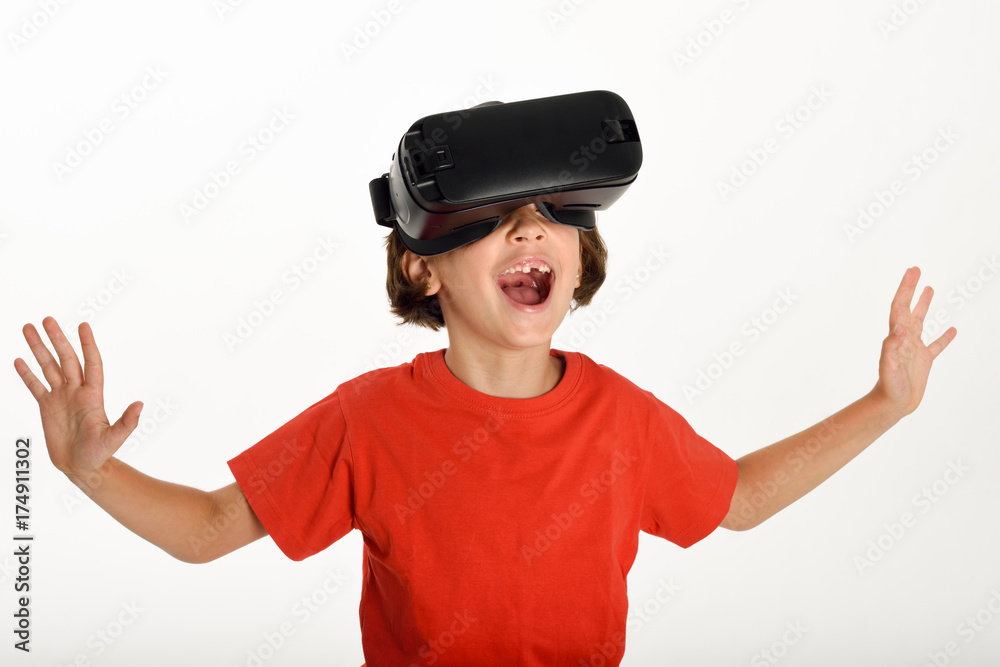 Little girl looking in VR glasses and gesturing with his hands. Little girl looking in VR glasses and gesturing with his hands.
