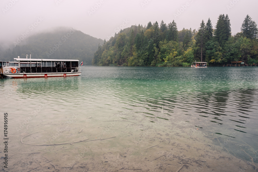 Fototapeta premium Pleasure boats on the pier in the Plitvice Lakes national park.