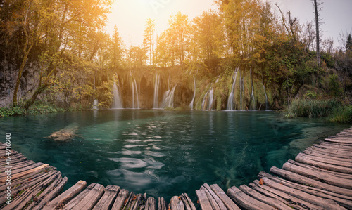 Scenic views of the turquoise water and sunlight. The famous Plitvice Lakes National Park, Croatia, Europe. Bright autumn scene.