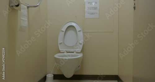 Wall hung toilet bowl in industrial lavatory
