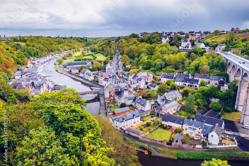 Aerial view of the historic town of Dinan with Rance river with dramatic cloudscape, Cotes-d'Armor department. Brittany (Bretagne), France © daliu